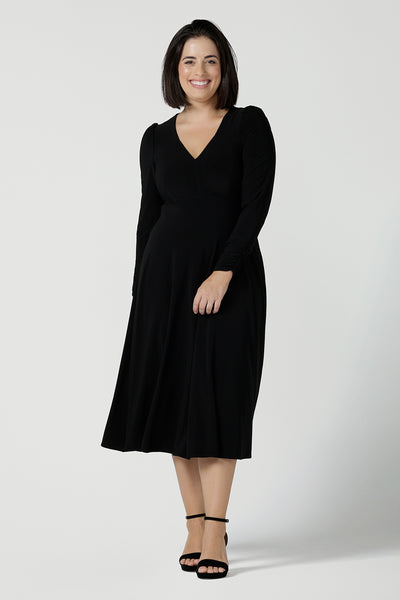 Size 10 Alyssa Dress in jersey. V-neckline style great for work to weekend wear. Corporate dress for women. Travel friendly with an empire line style. Midi dress and styled back with black strappy heels. Made in Australia for women size 8 - 24.