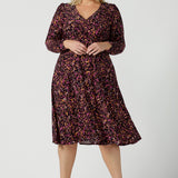 Size 18 woman wears the Alyssa dress in jersey. A high empire line style with a knee length design and ruched sleeve. Plus to petite size clothing made in Australia for women size 8 - 24. 