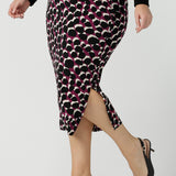 Andi Midi Skirt in Alula in a size 18 is a midi length skirt with the Alula print. Made in Australia style. Styled back with the Thom Top in black 8 -  24.