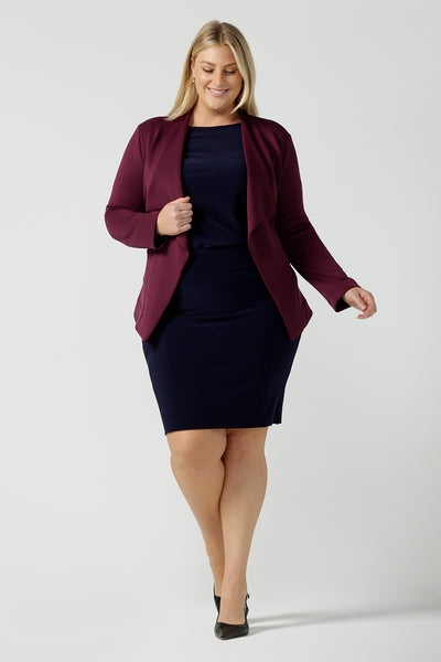 Size 18 woman wears the Lyndon Jacket in Wine a made in Australia jacket in comfortable and easy care modal fabric. Made in Australia for women size 8 - 24. Styled back with a Berit skirt in the Fitzroy print.