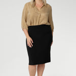 The Andi Tube Skirt in Black is a versatile essential from our luxe mix-and-match separates collection, ideal for the office, travel, or weekend styling.