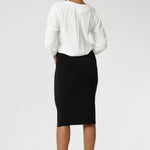 Now available in three lengths, this skirt is crafted from a black dry-touch jersey fabric with a soft stretch for ultimate comfort. Featuring a double-layer tube design, a soft folded waistband, and a convenient pull-on style, the Andi Tube Skirt offers a flattering regular length that pairs effortlessly with any wardrobe.