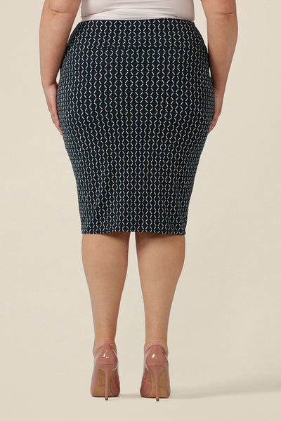 Back view of a good work wear for corporate women. This is a knee-length tube skirt in blue and white geometric print. Made in Australia, shop this work skirt online in sizes 8 to 24.