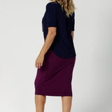 Back view of stretchy magenta tube skirt made from luxe dry touch jersey fabric that provides full body stretch and all day comfort. Australia made and available in sizes 8-24.