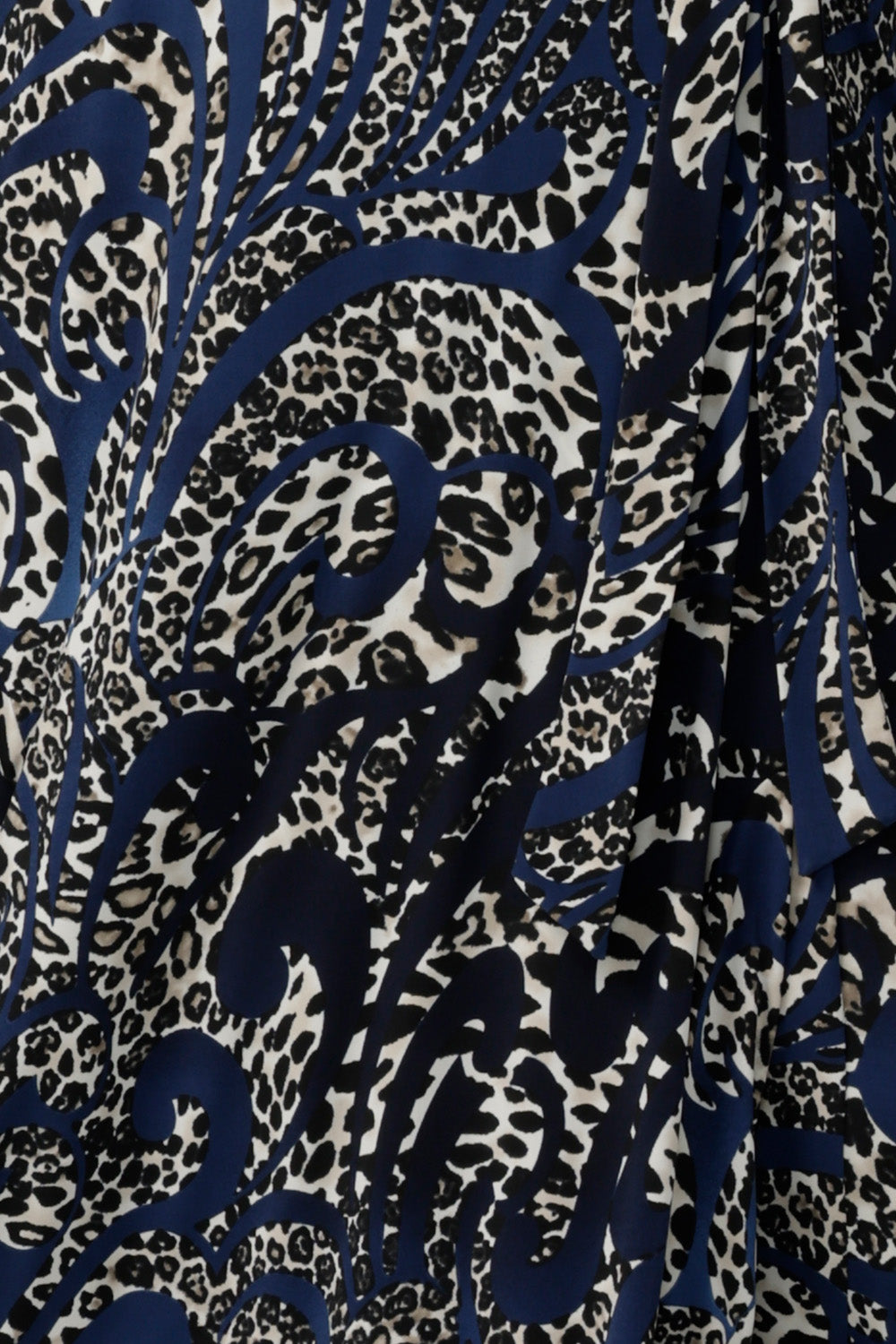 Swatch of an animal print jersey fabric on a navy base, used by Australian-made women's clothes brand, Leina & Fleur to make dresses, tops and pants in sizes 8-24.