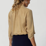 While the fabric has no stretch, it moves effortlessly, adding an air of elegance to any outfit. Semi-fitted blouse offers a flattering, streamlined silhouette, while the pull-on design makes it incredibly easy to wear. Available in sizes 8-24.