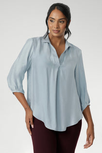 The Arley Shirt in Ice Blue offers a fresh take on everyday dressing with its clean, buttonless design and soft, suede-touch Tencel fabric. This pull-on style combines a sleek, contemporary silhouette with thoughtful detailing, making it a go-to piece for effortless polish. 