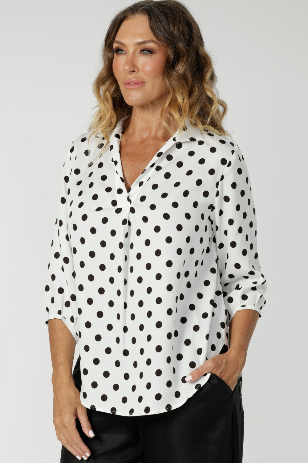 This elegant pull-on shirt offers a sophisticated yet comfortable style, perfect for everyday wear. Featuring a semi-fitted cut, it provides a flattering shape without being restrictive. The collar neckline adds a classic touch, while the subtle tuck details below the back neckline bring a refined, tailored look. Its 3/4 length soft sleeves are finished with narrow, bound hems for a neat, polished finish. 