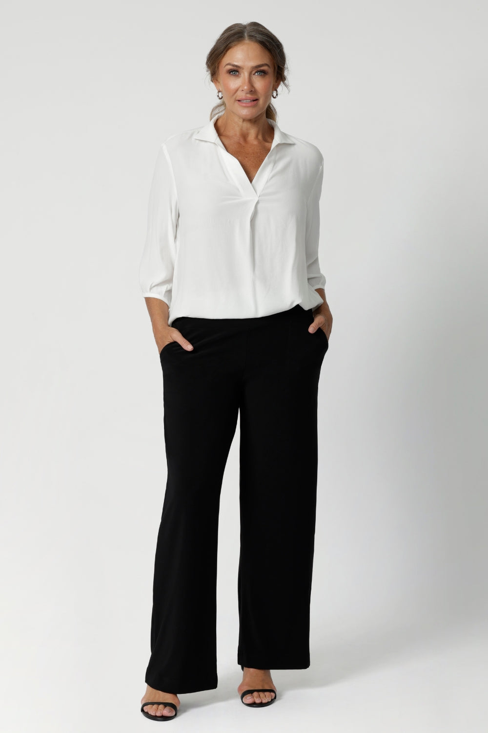 Over 40's women wears pull on style blouse, made in Australia from sustainable Tencel Viscose fabric. Easy care workwear blouse for women available in 2 colours and in sizes 8-24.