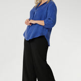 The Arley Shirt in Vivid Blue is a modern wardrobe staple that blends understated elegance with all-day comfort. Crafted from a luxurious suede-touch Tencel fabric, this buttonless, pull-on style offers a clean, contemporary silhouette that’s perfectly suited to office dressing and beyond. The semi-fitted shape creates a flattering line through the body, while the classic collar adds a sharp, structured touch.
