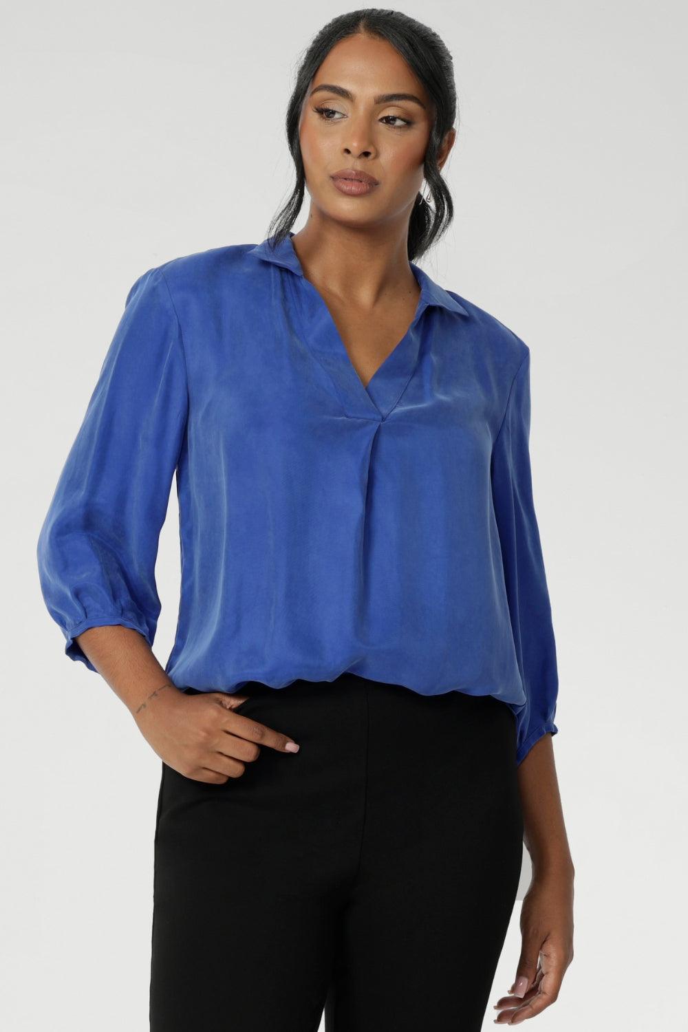 The Arley Shirt in Vivid Blue is a modern wardrobe staple that blends understated elegance with all-day comfort. Crafted from a luxurious suede-touch Tencel fabric, this buttonless, pull-on style offers a clean, contemporary silhouette that’s perfectly suited to office dressing and beyond.