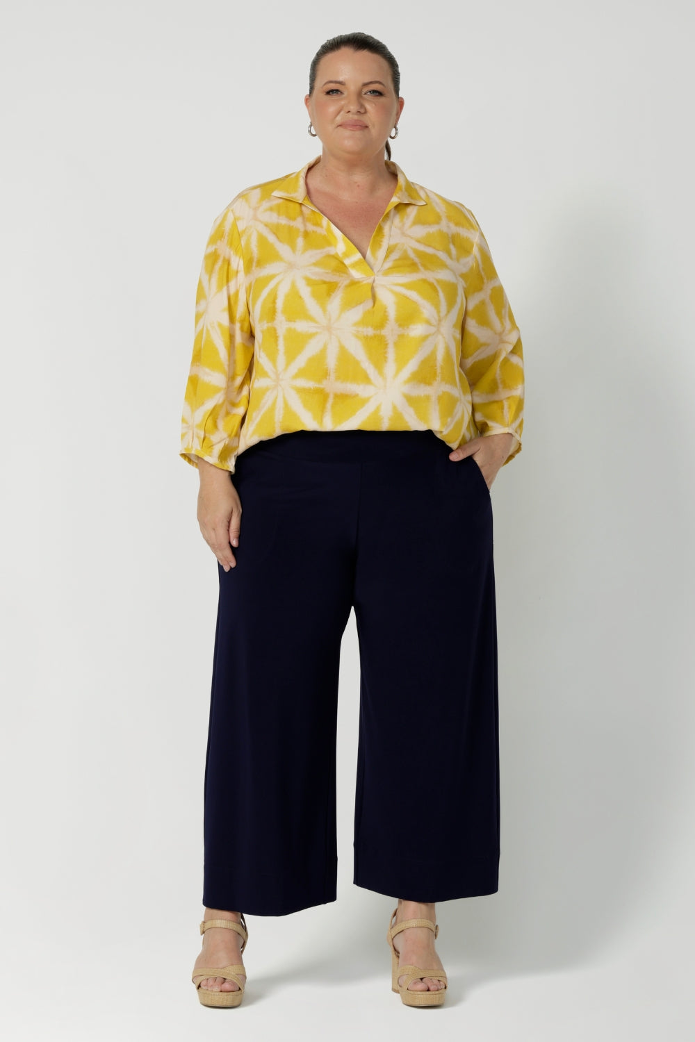 Size 18 model wears 3/4-length sleeved shirt that offers just the right amount of coverage. Easy care workwear shirt is made of tencel fabric. Available in sizes 8-24. This versatile piece is proudly made in Australia, blending style with conscious design and available in sizes 8-24.