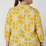 Back image of plus sized woman wearing yellow collard shirt. This pull-on style makes it easy to wear, while the semi-fitted silhouette creates a flattering shape without being too tight. Fabric has no stretch. Arley can be purchased in sizes 8-24.