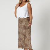 This Australian-made midi skirt is crafted from a soft-touch jersey fabric, offering a lightweight feel that's perfect for all-day comfort. Size 12 model wears travel ready skirt in soft animal print.