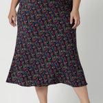 This Australian-made midi skirt is crafted from dry touch jersey fabric, offering a lightweight feel that's perfect for all-day comfort. Size 18 model wears travel ready skirt in Harmony print that features multi coloured daisies. 