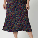 This Australian-made midi skirt is crafted from dry touch jersey fabric, offering a lightweight feel that's perfect for all-day comfort. Size 18 model wears travel ready skirt in Harmony print that features multi coloured daisies. 