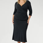 Elevate your workwear wardrobe with this stylish midi skirt, designed to flatter and move with you. Crafted from navy printed dry touch jersey fabric. Women's workwear skirt features a bias-cut design that drapes beautifully, creating an effortless, fluid silhouette that’s both flattering and comfortable. 