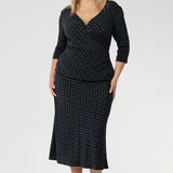 Elevate your workwear wardrobe with this stylish midi skirt, designed to flatter and move with you. Crafted from navy printed dry touch jersey fabric. Women's workwear skirt features a bias-cut design that drapes beautifully, creating an effortless, fluid silhouette that’s both flattering and comfortable. 