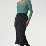 Ideal for both work and travel, this sleek and sophisticated skirt is made from easy-care dry-touch jersey, which is wrinkle-resistant for all-day wear. Available in sizes 8 to 24, it pairs effortlessly with a variety of tops and jackets, offering versatility and style for any occasion.