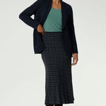 Crafted from easy-care, wrinkle-resistant dry-touch jersey, this skirt is designed for all-day comfort and effortless styling. A true all-season piece, it can be worn year-round—pair it with stockings and boots during the winter or layer it under coats and jackets with ease. Available in sizes 8 to 24, this skirt offers both style and practicality, making it an essential staple for any wardrobe.