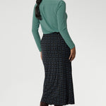 This chic midi skirt is the perfect addition to your workwear collection, combining elegance with comfort. Flattering bias cut skirt offers a fluid silhouette that moves with you. Darts at the back enhance your natural shape, while preserving the A-line structure for a sleek, feminine finish. Crafted from easy-care, wrinkle-resistant dry-touch jersey, this skirt is perfect for both work and travel.