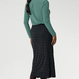 This chic midi skirt is the perfect addition to your workwear collection, combining elegance with comfort. Flattering bias cut skirt offers a fluid silhouette that moves with you. Darts at the back enhance your natural shape, while preserving the A-line structure for a sleek, feminine finish. Crafted from easy-care, wrinkle-resistant dry-touch jersey, this skirt is perfect for both work and travel.