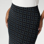 Made from printed navy dry-touch fabric that is easy care and comfortable. The bias-cut design of the skirt drapes beautifully, creating a flattering, fluid silhouette that moves with you. Available in sizes 8-24.