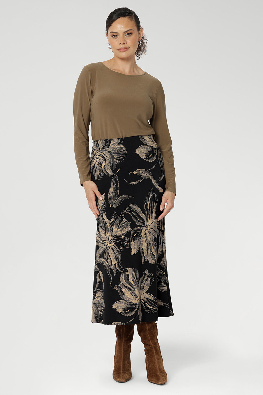 The Asher Skirt is a refined essential, crafted from our signature black dry-touch stretch jersey for a smooth, comfortable fit. Featuring a rich, inky floral print in a warm coffee hue, it captures the mood of the season with understated elegance. 