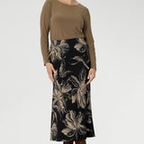 The Asher Skirt is a refined essential, crafted from our signature black dry-touch stretch jersey for a smooth, comfortable fit. Featuring a rich, inky floral print in a warm coffee hue, it captures the mood of the season with understated elegance. 