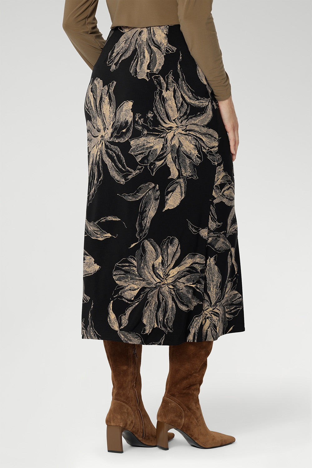 Featuring a rich, inky floral print in a warm coffee hue, it captures the mood of the season with understated elegance. The A-line silhouette is cut on the bias for fluid movement and subtle drape, while the internal elastic waistband ensures a seamless, pull-on fit.