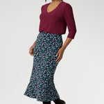 Designed with travel in mind, this midi-length skirt glides easily over the body thanks to its bias cut, offering a fluid drape that flatters without clinging. The pull-on style with a smooth internal elastic waistband keeps things simple and comfortable, while subtle back darts provide soft shaping through the waist and hips. With its clean A-line silhouette and unlined, pocket-free design, Asher maintains a sleek look that layers beautifully across seasons.