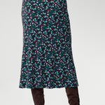 Cut on the bias for a naturally flattering drape, this pull-on midi skirt glides over the body with ease, offering both comfort and quiet elegance. A soft internal elastic waistband ensures a smooth fit, while subtle darts at the back create gentle shaping through the waist and hips. Available in sizes 8-24.