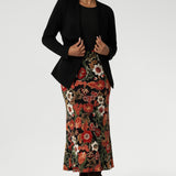 Sophisticated, versatile, and made to flatter — the Lyndon Jacket blends comfort and elegance. Size 10 model wears her Lyndon Jacket in Black with printed midi length skirt with brown long boots. Available in size 8-24.