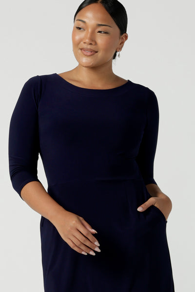 Close up of a size 10 woman wears the Audrey Shift Dress in Navy is the perfect all season shift dress. Soft jersey fabric, 3/4 sleeves and pockets. Made in Australia for women size 8 - 24.