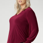 A flattering V-neckline and carefully placed bust darts enhance the feminine shape, making this top ideal for work, dinners, or stylish daywear. The back shoulder yoke is finished with gentle gathers, offering subtle movement and texture. The curved shirt-tail hemline flatters the hips when worn loose and maintains a chic, modern vibe if you prefer to French tuck. Available in inclusive sizes 8 to 24.