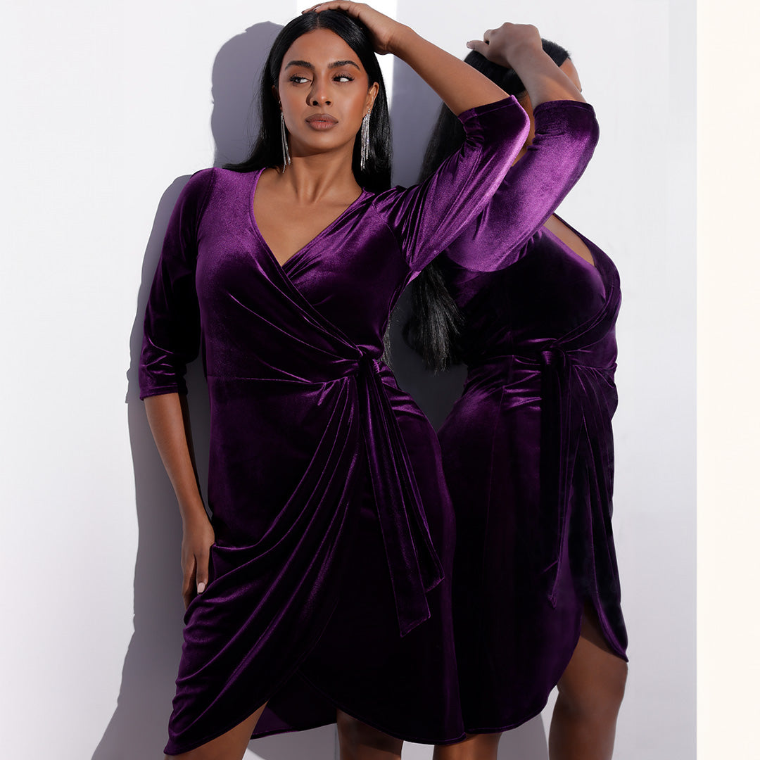 Searching for 'cocktail dresses Australia?' Look no further, this jewel tone purple velour wrap dress comes in size 8 to 24. made in Australia by women's evening wear brand Leina & Fleur, this cocktail wrap with 3/4 sleeves has a tulip shaped hemline. 