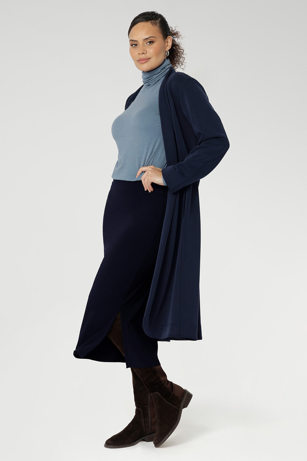 Elevate your wardrobe with the sophisticated Andi Midi Skirt in Navy, designed to keep you both work- and event-ready. Crafted from a navy dry-touch jersey fabric, this skirt offers a soft stretch for all-day comfort.