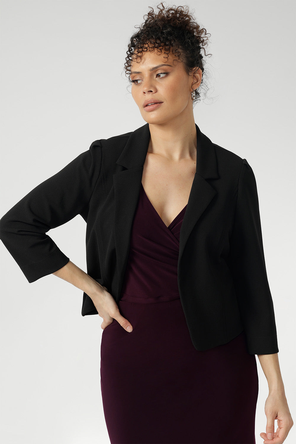 Crafted from Black Scuba Crepe Jersey, this fabric combines a soft stretch with a luxurious feel, ensuring both comfort and structure throughout the day. The open-front design creates a sleek, modern look, making it easy to layer over both formal and casual outfits.