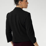 This black cropped jacket exudes sophisticated, modern tailoring, crafted from a luxe Scuba Crepe fabric. The fabric’s soft, textured feel and slight stretch provide both comfort and a flattering fit.