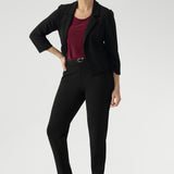 The Benni Jacket is the perfect piece to elevate your trans-seasonal wardrobe, offering both style and versatility. Crafted from Black Scuba Crepe Jersey, this fabric combines a soft stretch with a luxurious feel, ensuring both comfort and structure throughout the day.