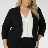 Womens workwear jackets features open-front design allowing for effortless styling, while the narrow collar and notch lapels add a touch of sharpness to its clean lines. The double-layered front panels contribute to the structured, tailored silhouette, enhancing the overall sense of refinement. Available in sizes 8-24.