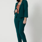 Green 3/4 sleeve cropped jacket. Stretch jersey womens cropped blazer. Worn with tapered leg green pant. Work outfit for L&F Womens fashion Australia.