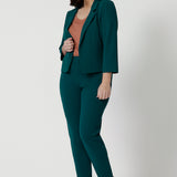 Green 3/4 sleeve cropped jacket. Stretch jersey womens cropped blazer. Worn with tapered leg green pant. Work outfit for L&F Womens fashion Australia.