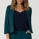 A great workwear jacket for women over 40, the Benni 3/4 sleeve jacket is worn with a navy V-top in slinky jersey. 
A cropped green jacket , it makes a good workwear suit for women. In sizes 8 to 24, this womens jacket is made in Australia for petite to plus size women. So if you're looking for workwear outfits for curvy women, shop online at Leina & Fleur!  