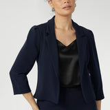 Navy workwear jakcket features open-front design allowing for effortless styling, while the narrow collar and notch lapels add a touch of sharpness to its clean lines. 