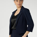 The double-layered front panels contribute to the structured, tailored silhouette, enhancing the overall sense of refinement. Available in sizes 8-24.