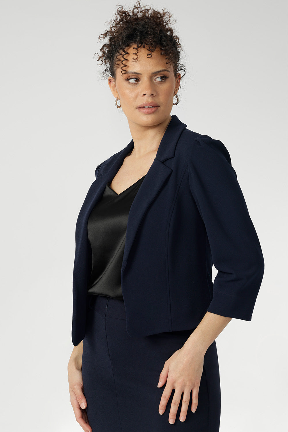The double-layered front panels contribute to the structured, tailored silhouette, enhancing the overall sense of refinement. Available in sizes 8-24.