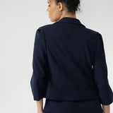 Navy workwear cropped jacket exudes sophisticated, modern tailoring, crafted from a luxe Scuba Crepe fabric. The fabric’s soft, textured feel and slight stretch provide both comfort and a flattering fit. 