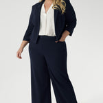 Navy workwear jacket features open-front design allowing for effortless styling, while the narrow collar and notch lapels add a touch of sharpness to its clean lines. 