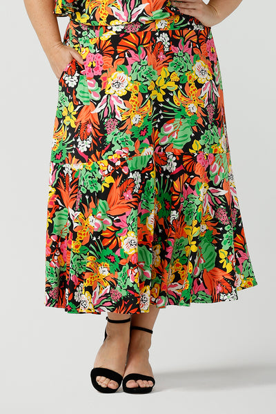 Close up of curvy woman wearing a colourful tiered skirt with off shoulder top. Beautiful Cancun print in multi-colour soft jersey. The perfect statement outfit for the summer season. Designed and made in Australia sizes 8-24.